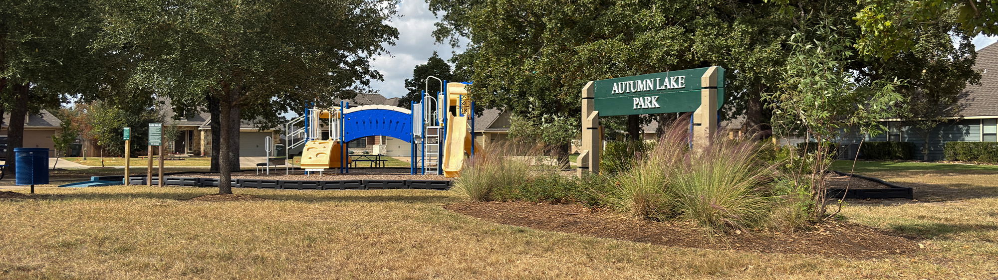 Autumn Lake Park and playground on a sunny day.